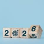 Wooden blocks with numbers and target icon for 2022.